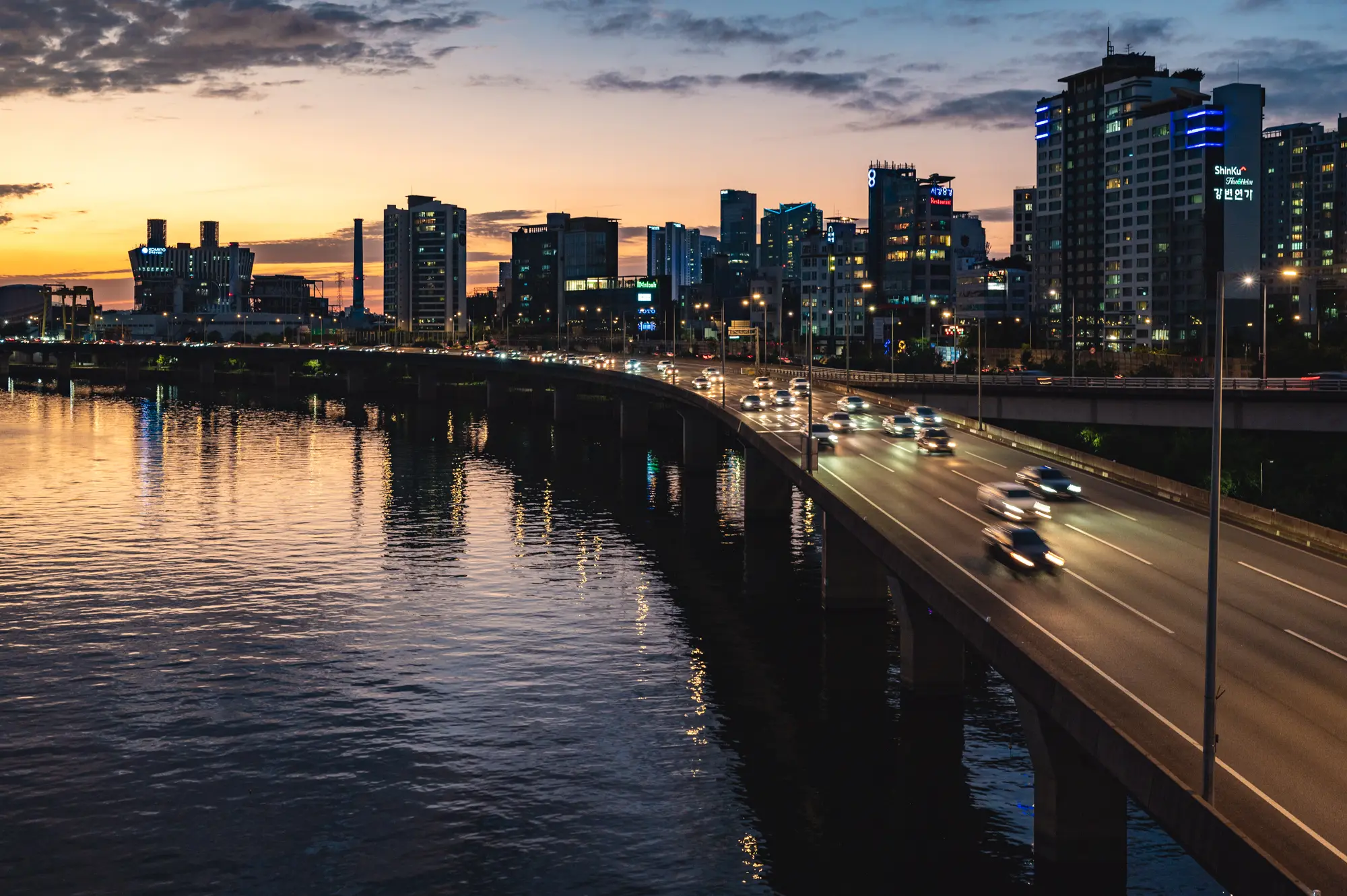 image of couple in front of Seoul logo